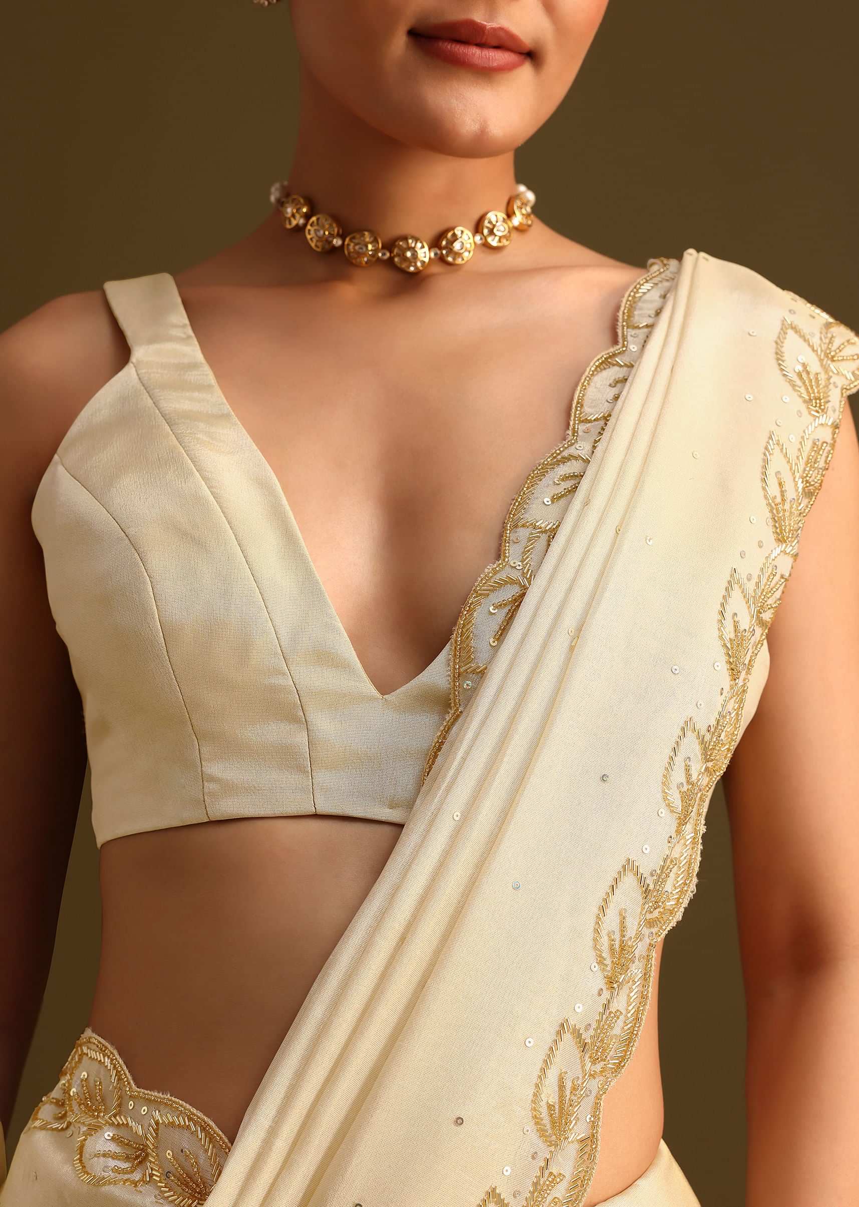 Ivory Tissue Saree With Cutdana Embroidered Border and Unstitched Blouse